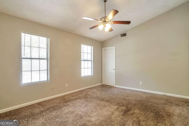 5379 Winslow Xing, Lithonia, GA 30038 - carpeted empty room featuring baseboards, ceiling fan, lofted ceiling, and visible vents
