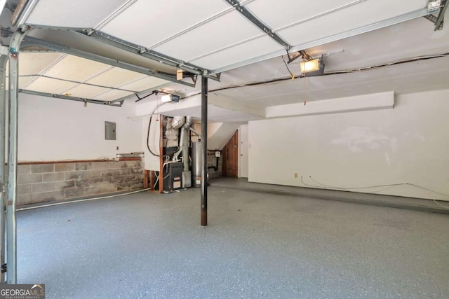 5379 Winslow Xing, Lithonia, GA 30038 - basement with electric panel, a garage, concrete block wall, water heater, and heating unit