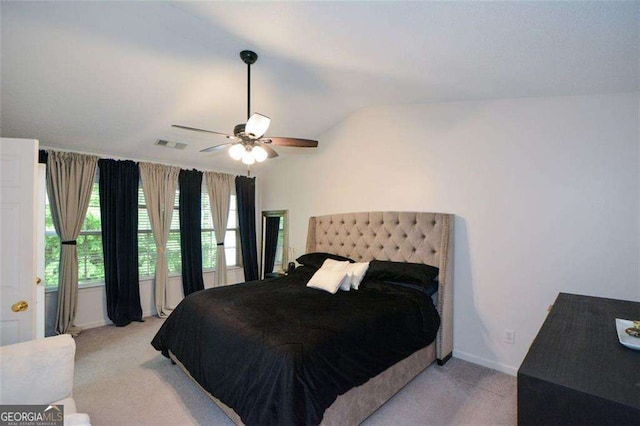 bedroom featuring baseboards, visible vents, ceiling fan, and light colored carpet