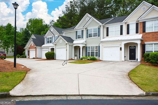 view of front of home featuring a garage and driveway