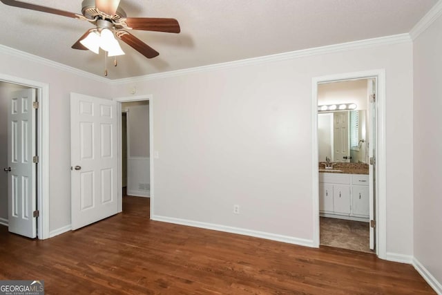 2636 Suzanne Ln, Acworth, GA 30102 - unfurnished bedroom with dark wood-style floors, a sink, baseboards, ensuite bathroom, and ornamental molding