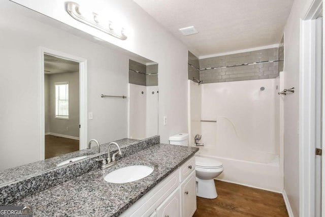 2636 Suzanne Ln, Acworth, GA 30102 - bathroom with vanity, bathtub / shower combination, toilet, and wood finished floors