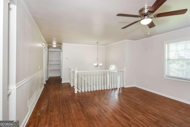 2636 Suzanne Ln, Acworth, GA 30102 - empty room with visible vents, ornamental molding, ceiling fan with notable chandelier, and wood finished floors