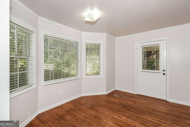 2636 Suzanne Ln, Acworth, GA 30102 - spare room with crown molding, baseboards, visible vents, and wood finished floors