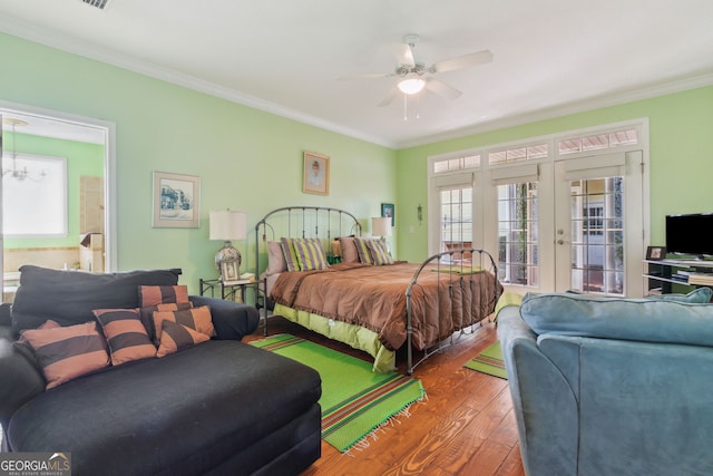 bedroom with french doors, a ceiling fan, access to exterior, wood finished floors, and ornamental molding
