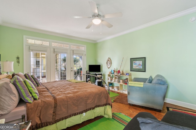 bedroom with a ceiling fan, french doors, access to exterior, wood finished floors, and ornamental molding