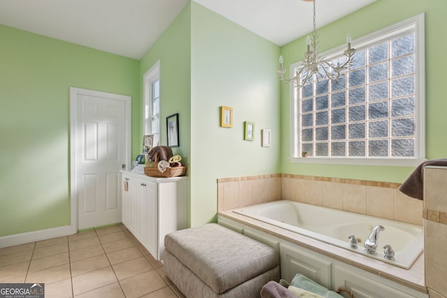 full bath featuring a healthy amount of sunlight, tile patterned flooring, and a bath