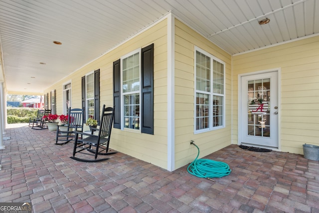 view of patio featuring a porch
