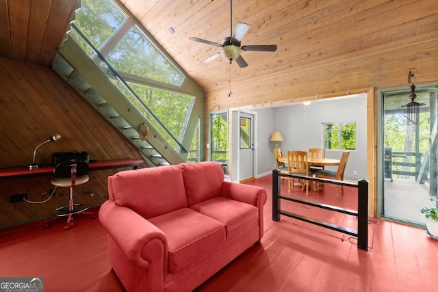115 Rabbit Run, Dawsonville, GA 30534 - living area featuring wood walls, a ceiling fan, wood finished floors, and high vaulted ceiling