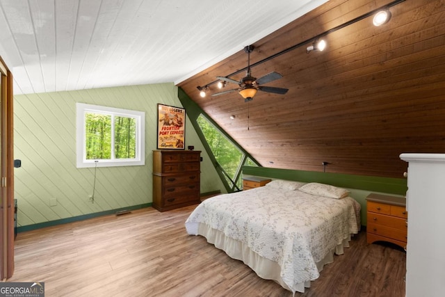 115 Rabbit Run, Dawsonville, GA 30534 - bedroom with wood finished floors, wood walls, baseboards, and lofted ceiling