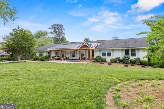 single story home with an outdoor hangout area and a front yard