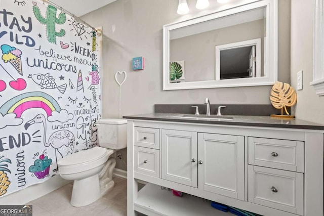 bathroom featuring a shower with curtain, tile patterned floors, vanity, and toilet
