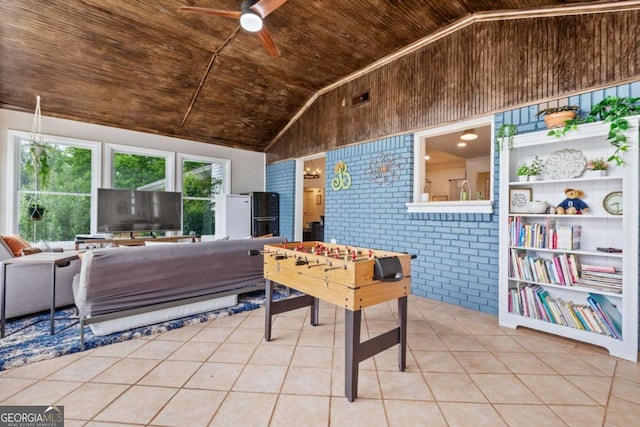 rec room with brick wall, vaulted ceiling, wood ceiling, and tile patterned floors