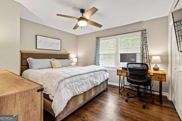 bedroom with baseboards, ceiling fan, and wood finished floors