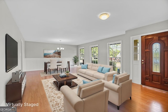 115 Linda Way, Fayetteville, GA 30215 - living area featuring a wainscoted wall, wood finished floors, and a chandelier