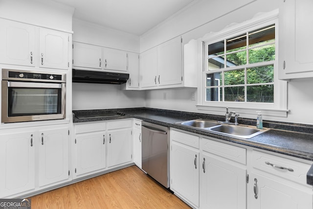 115 Linda Way, Fayetteville, GA 30215 - kitchen with a sink, under cabinet range hood, dark countertops, and stainless steel appliances