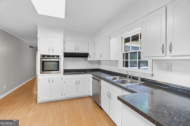 115 Linda Way, Fayetteville, GA 30215 - kitchen with a sink, white cabinets, under cabinet range hood, ornamental molding, and stainless steel appliances