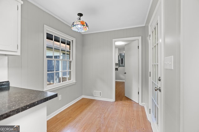 115 Linda Way, Fayetteville, GA 30215 - unfurnished dining area featuring crown molding, light wood-style floors, baseboards, and visible vents
