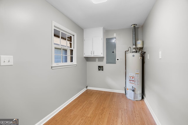 115 Linda Way, Fayetteville, GA 30215 - laundry area with hookup for an electric dryer, electric panel, cabinet space, water heater, and light wood-style flooring