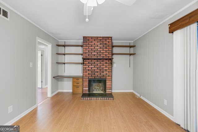 115 Linda Way, Fayetteville, GA 30215 - unfurnished living room with visible vents, crown molding, wood finished floors, a fireplace, and ceiling fan