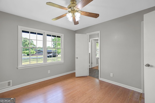 115 Linda Way, Fayetteville, GA 30215 - unfurnished bedroom with a ceiling fan, baseboards, visible vents, and light wood-style flooring