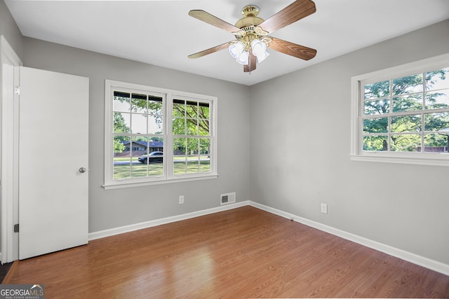 115 Linda Way, Fayetteville, GA 30215 - unfurnished room featuring visible vents, plenty of natural light, and wood finished floors