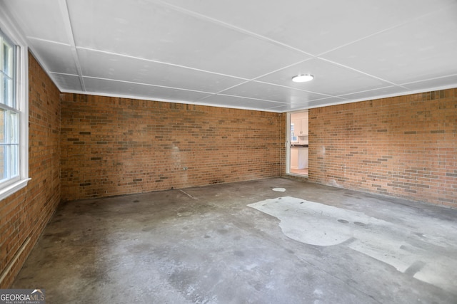 115 Linda Way, Fayetteville, GA 30215 - unfurnished room featuring concrete floors and brick wall