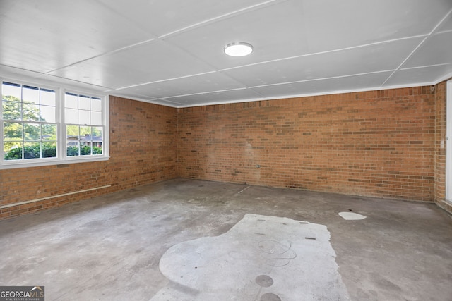 115 Linda Way, Fayetteville, GA 30215 - interior space with concrete floors and brick wall