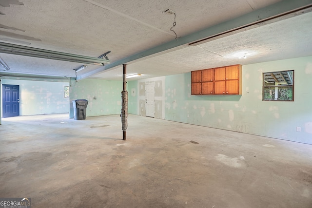 115 Linda Way, Fayetteville, GA 30215 - basement featuring a textured ceiling and a garage