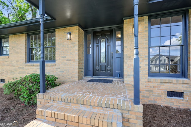 115 Linda Way, Fayetteville, GA 30215 - view of exterior entry with covered porch, crawl space, and brick siding