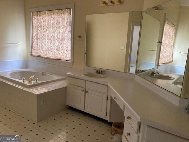 140 Cedar Creek Dr, Dublin, GA 31021 - full bathroom featuring a garden tub, tile patterned floors, and vanity