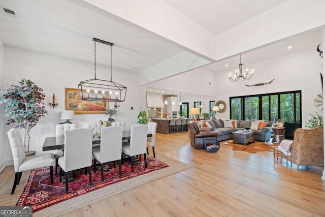 281 Abbott Dr, Canton, GA 30114 - dining area featuring a chandelier, light wood finished floors, recessed lighting, and a high ceiling