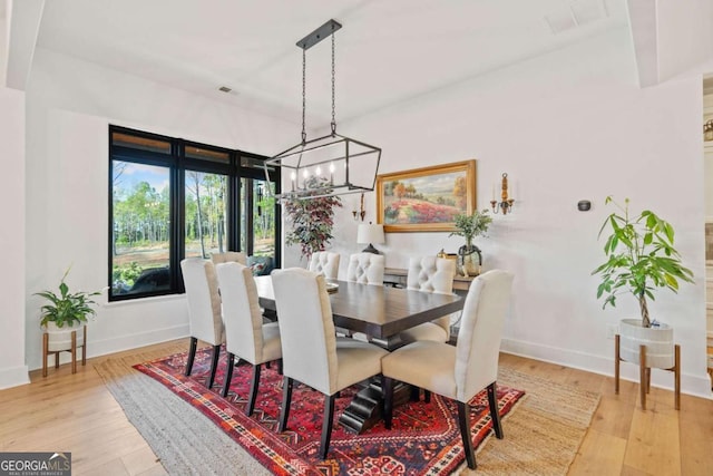 281 Abbott Dr, Canton, GA 30114 - dining space with wood finished floors, baseboards, and a chandelier