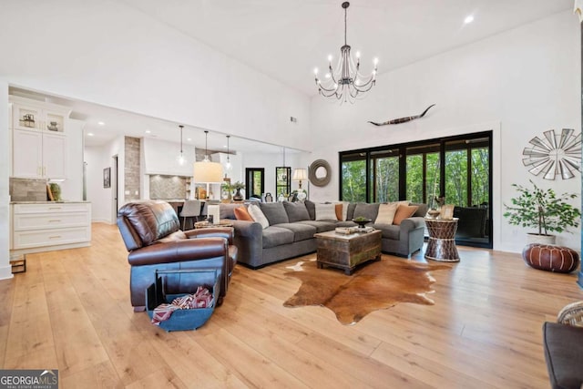 281 Abbott Dr, Canton, GA 30114 - living room with a towering ceiling, a chandelier, plenty of natural light, light wood-type flooring, and recessed lighting