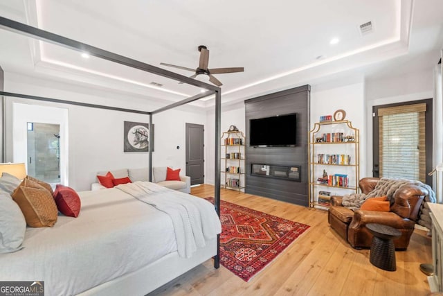 281 Abbott Dr, Canton, GA 30114 - bedroom with a raised ceiling, wood finished floors, recessed lighting, and ceiling fan