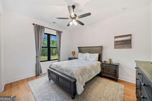 281 Abbott Dr, Canton, GA 30114 - bedroom featuring baseboards, light wood finished floors, and ceiling fan