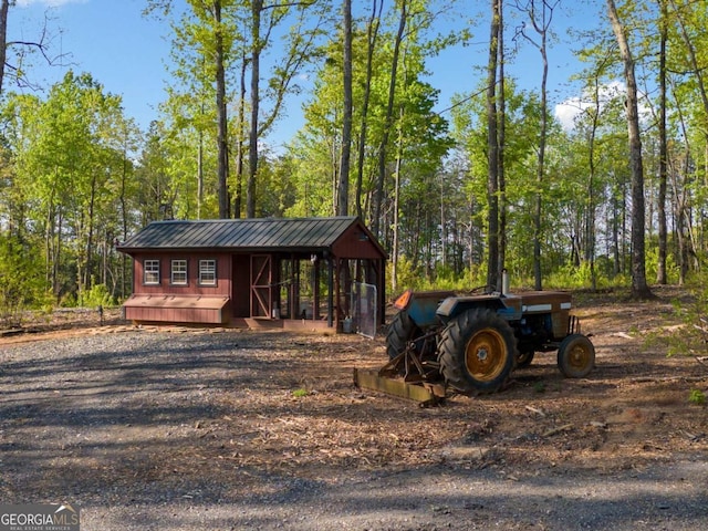 281 Abbott Dr, Canton, GA 30114 - view of outdoor structure featuring a wooded view