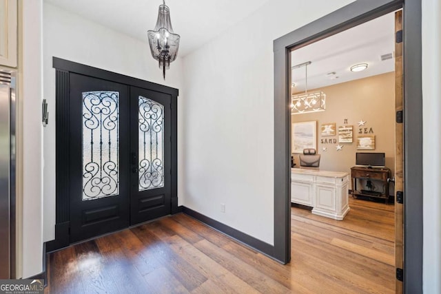 281 Abbott Dr, Canton, GA 30114 - entryway featuring a chandelier, light wood-type flooring, french doors, and baseboards