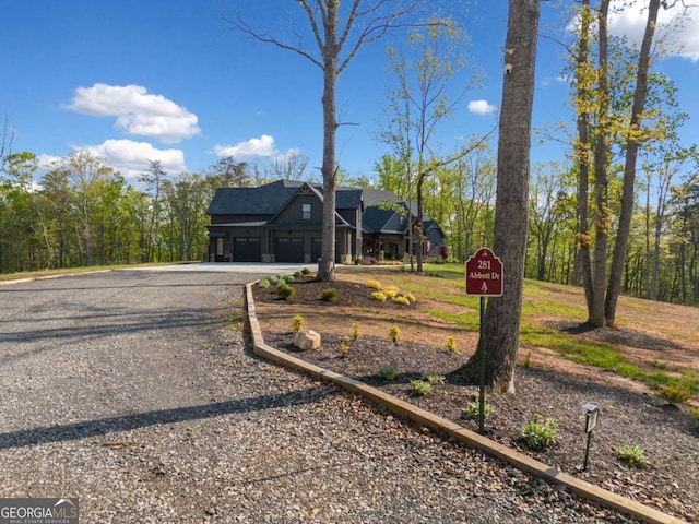 281 Abbott Dr, Canton, GA 30114 - view of front facade featuring driveway and an attached garage