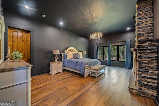 281 Abbott Dr, Canton, GA 30114 - bedroom featuring wood-type flooring, a chandelier, and recessed lighting