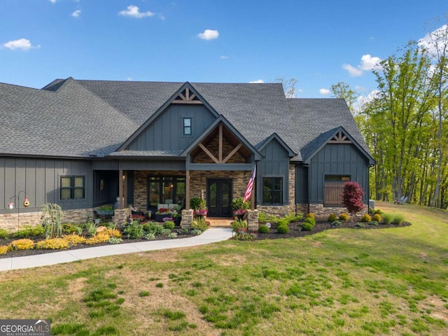 281 Abbott Dr, Canton, GA 30114 - craftsman-style home featuring board and batten siding, roof with shingles, and stone siding