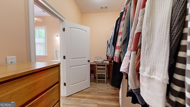 spacious closet featuring visible vents and light wood-type flooring