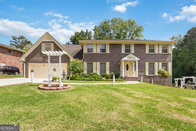 5152 Clearwater Dr, Stone Mountain, GA 30087 - colonial-style house featuring brick siding, a garage, a front lawn, and driveway