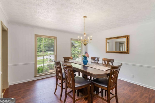 5152 Clearwater Dr, Stone Mountain, GA 30087 - dining space featuring an inviting chandelier, a textured ceiling, dark wood-style flooring, and baseboards