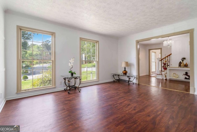 5152 Clearwater Dr, Stone Mountain, GA 30087 - interior space featuring a wealth of natural light, a notable chandelier, a textured ceiling, and wood finished floors