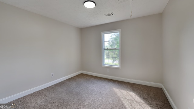 931 Justin Dr, Winder, GA 30680 - empty room with carpet floors, baseboards, and attic access