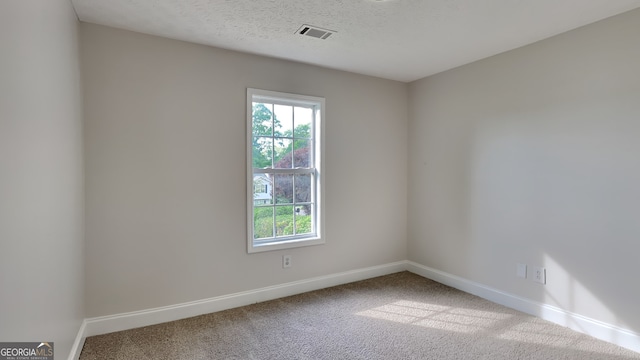 931 Justin Dr, Winder, GA 30680 - carpeted empty room with baseboards, visible vents, and a wealth of natural light