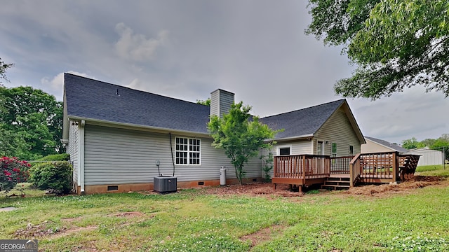 931 Justin Dr, Winder, GA 30680 - back of property with a yard, crawl space, and a deck