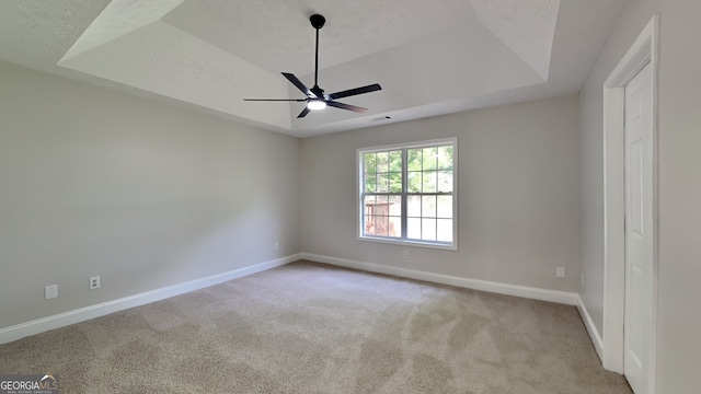 931 Justin Dr, Winder, GA 30680 - carpeted empty room featuring a raised ceiling, baseboards, ceiling fan, and visible vents