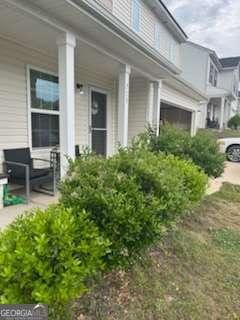 713 Dove Tree Ln, Social Circle, GA 30025 - view of home's exterior with a porch